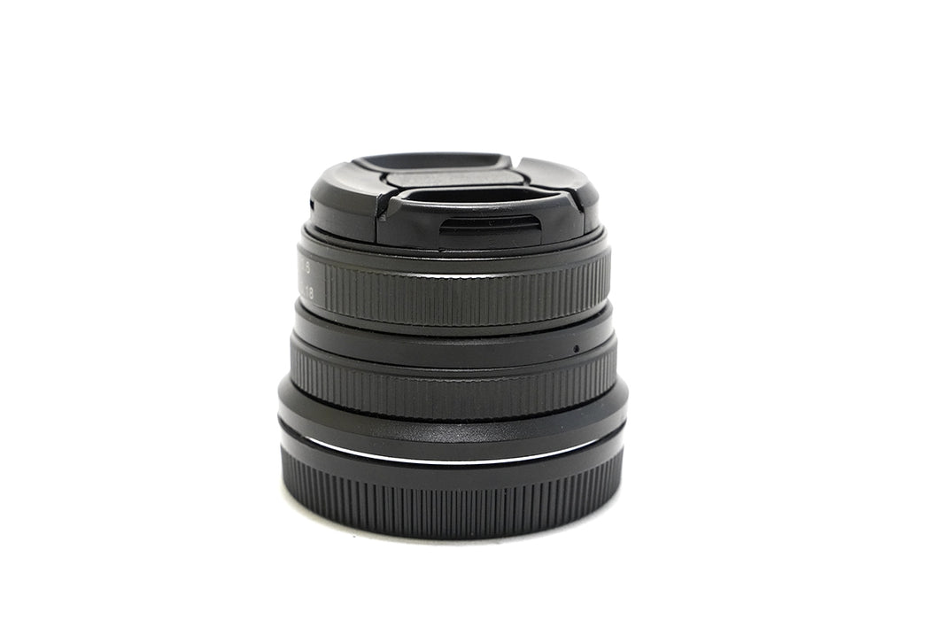 Obiettivo manuale Neewer per Canon Eos M 25mm f1.8 - bellissimo, con sacchetto in cuoio