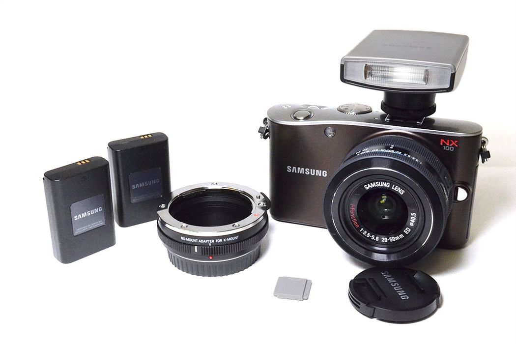 FOTOCAMERA SAMSUNG NX100 + OB.20-50MM F3.5-5.6 ED + N.2 BATTERIE CON BORSA