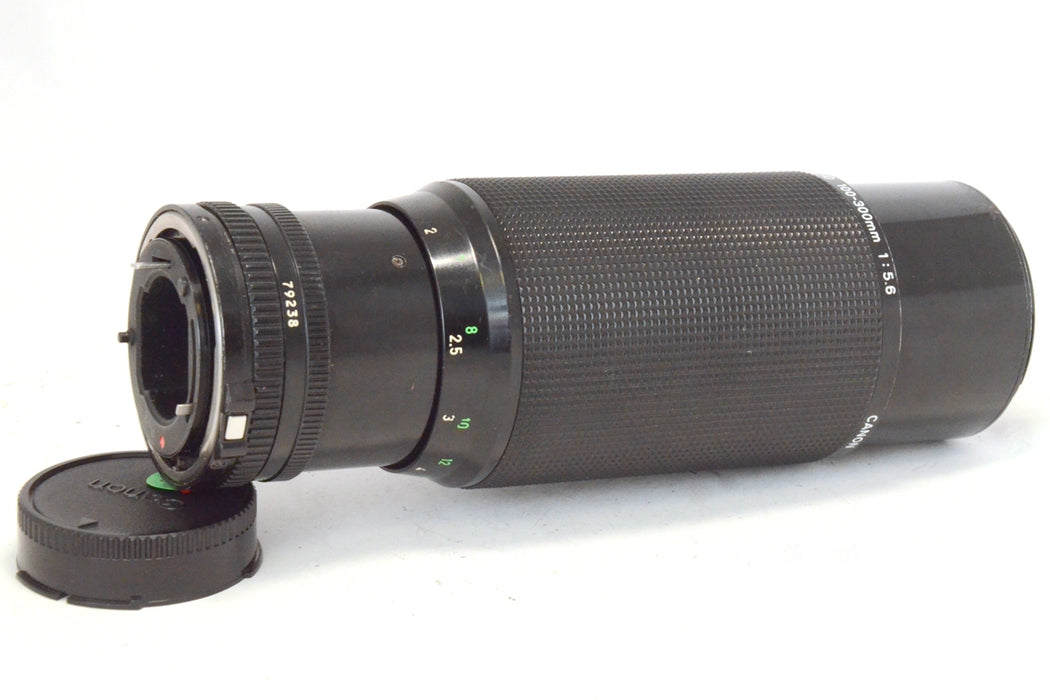 Canon FD Zoom 100-300mm F5.6. Obiettivo Zoom con Tappi Originali